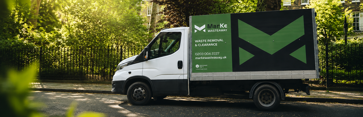 Waste removal team loading clearance van